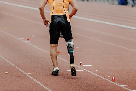 disabled male athlete running on track